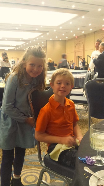 A smiling boy named Richard, a Special Olympics Indiana athlete, and his friend.