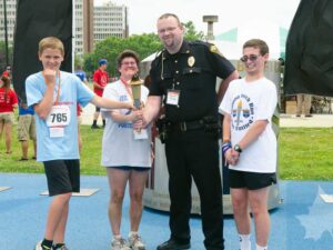 Indiana Police Chief Brendan Bridges pictured with Special Olympics Indiana athletes