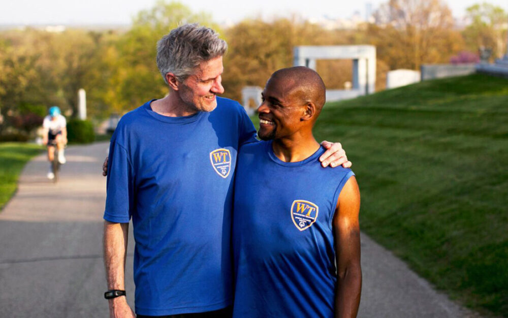 Andrew Petersen and coach Craig Peterson smile for Special Olympics Indiana.