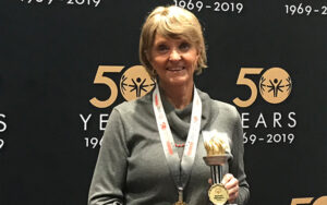 Lynne Noble accepts award as 2019 Spirit of Special Olympics Volunteer of the Year.