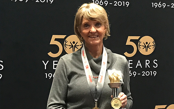 Lynne Noble accepts award as 2019 Spirit of Special Olympics Volunteer of the Year.