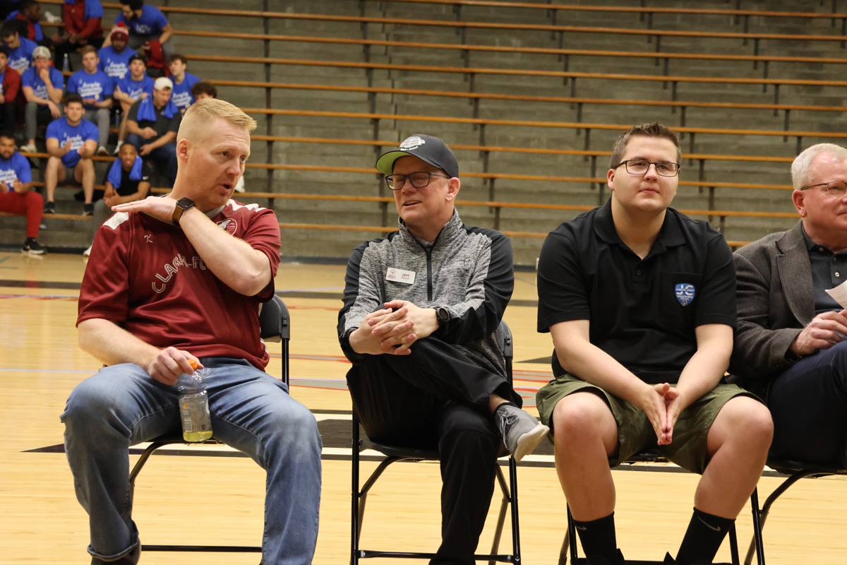 Sport Coaches chat on the sidelines of game