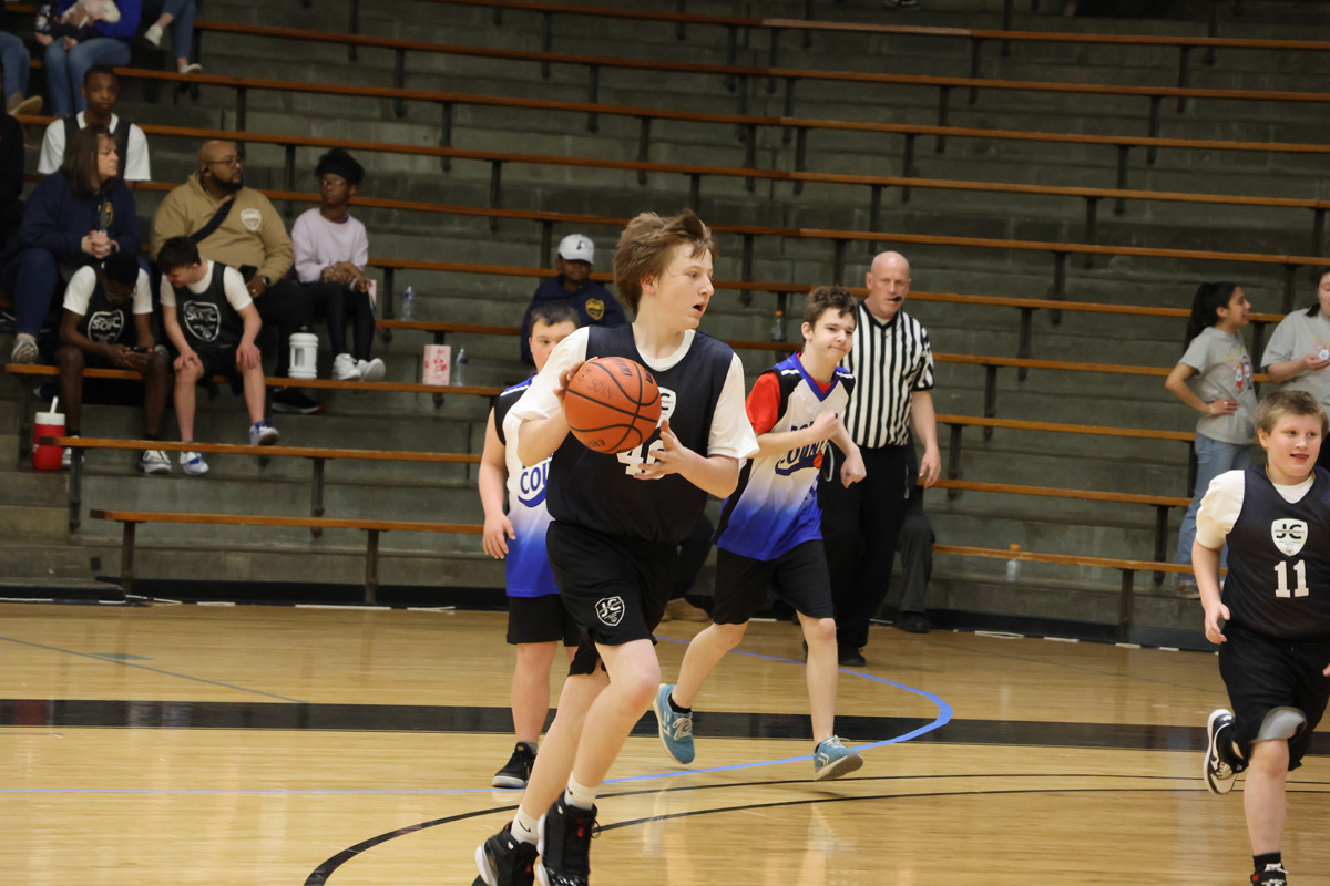 Basketball athlete running with the ball