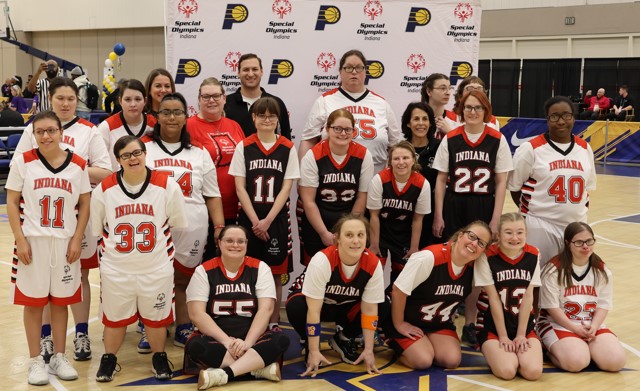 The picture shows the full, female Special Olympics team in a team photo. 