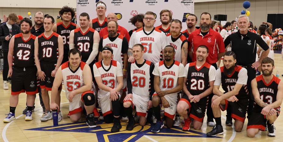 The picture shows the full, male Special Olympics team in a team photo. 