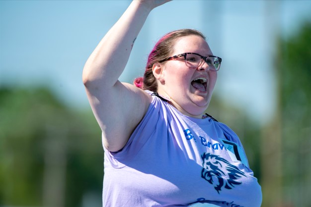 Image of girl celebrating with arm in the air.